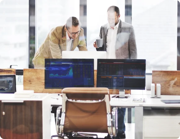 Two people working on computer