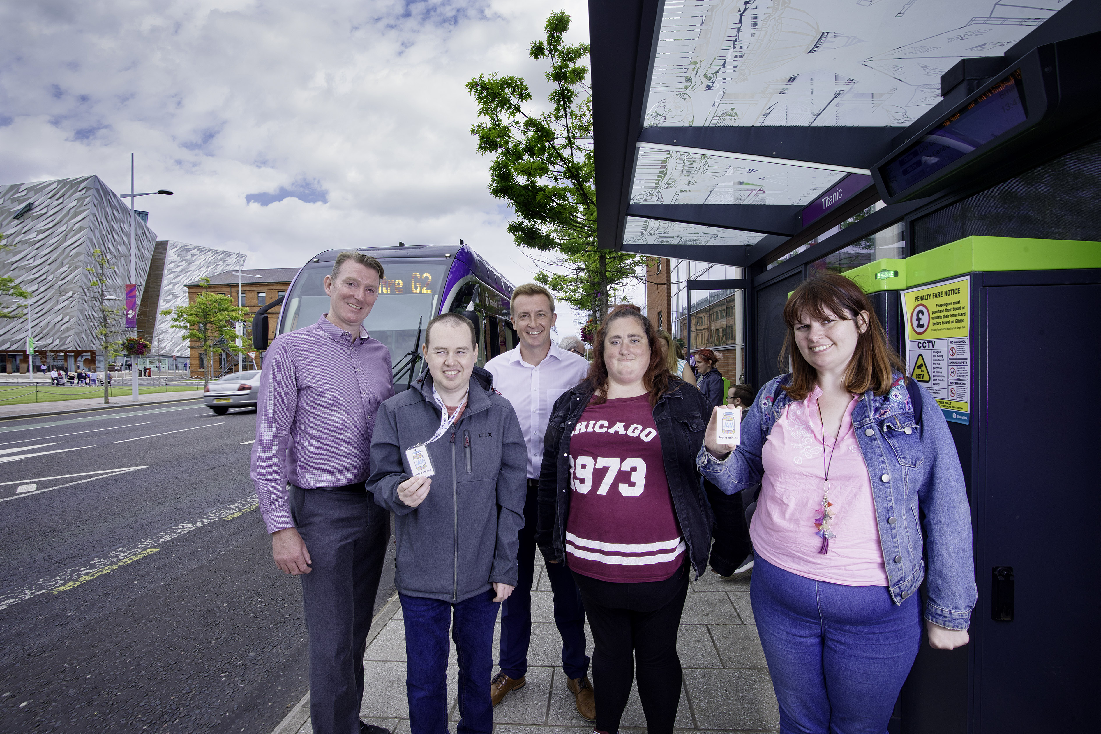 Damian Bannon (Translink) with Matthew Wilks (Vix Technology) and participants from NOW Group using public transport