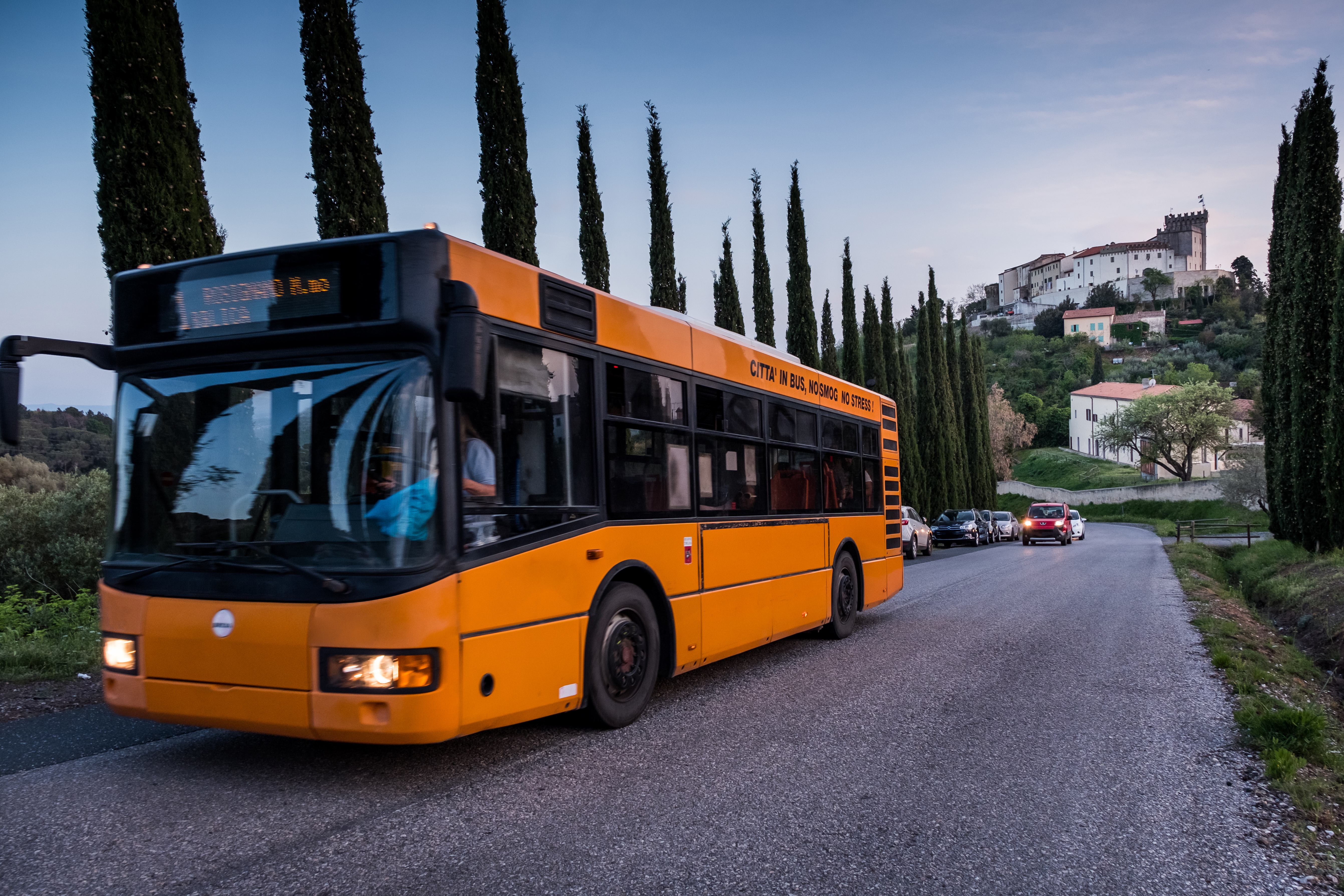 Rosignano Marittimo, Tuscany - public transportation bus with view of the castle from the cypress road, located in the province of Leghorn, from the square with the Church of San Ilario and the castle built in the year 1100 you can enjoy the view towards the sea of Rosignano Solvay, Vada and Castiglioncello, panoramic view from the Poggetti path